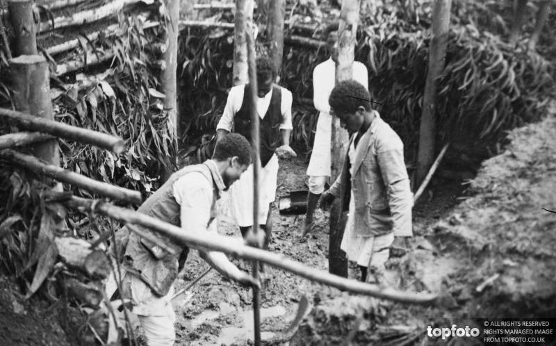 Schoolchildren dig bomb proof shelters