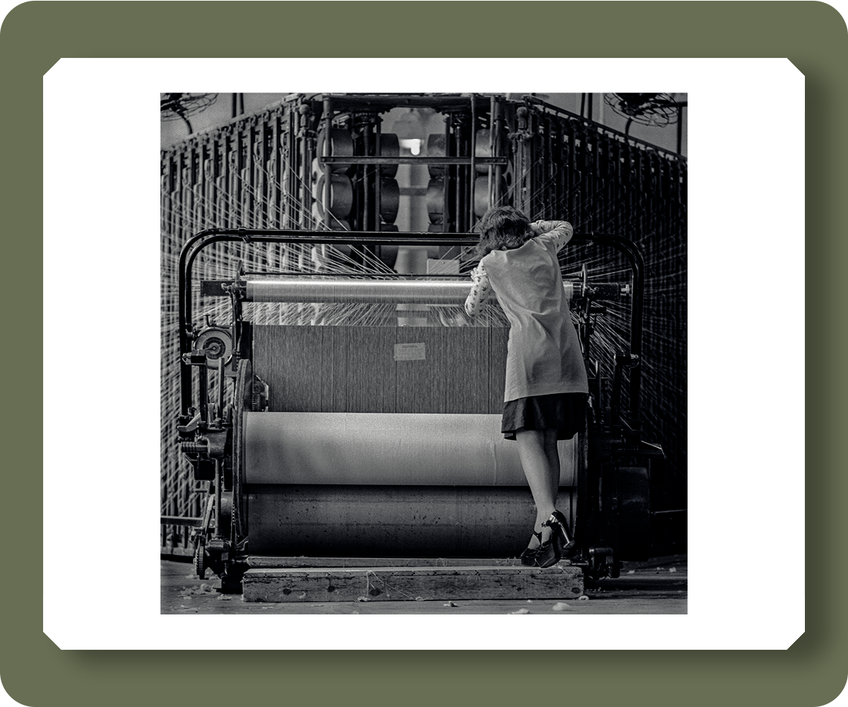 pd3012739: Textile factory worker in West Yorkshire wearing high heel platform shoes -  Credit: Robert Golden / TopFoto