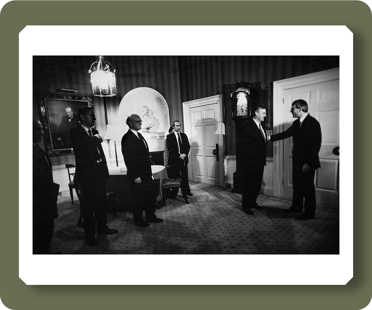 Vladimir Putin in the shadows as a Russian delegation headed by the Mayor of St Petersburg, Anatoly Sobchak, is greeted by Prime Minister John Major in No. 10 Downing Street on September 20, 1991 - pd3026820  Credit: Brian Harris / The Independent / Topfoto 